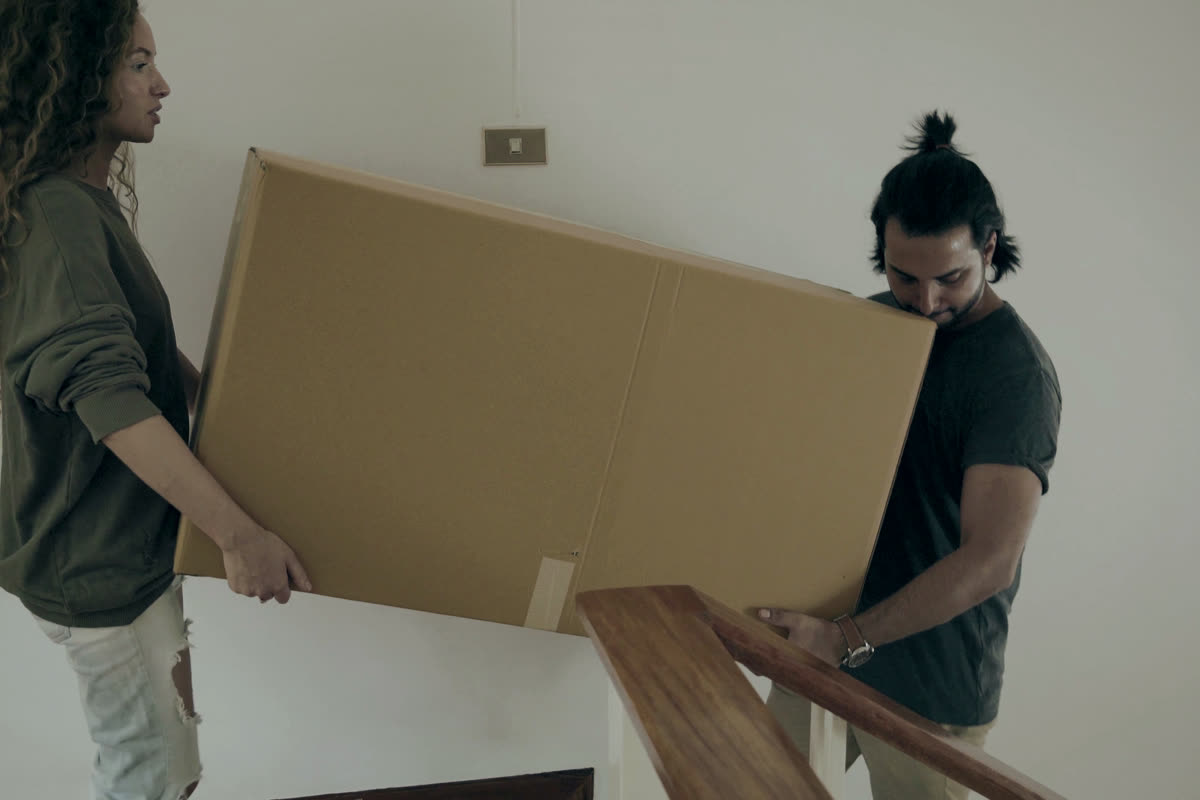 Carrying a box down the stairs