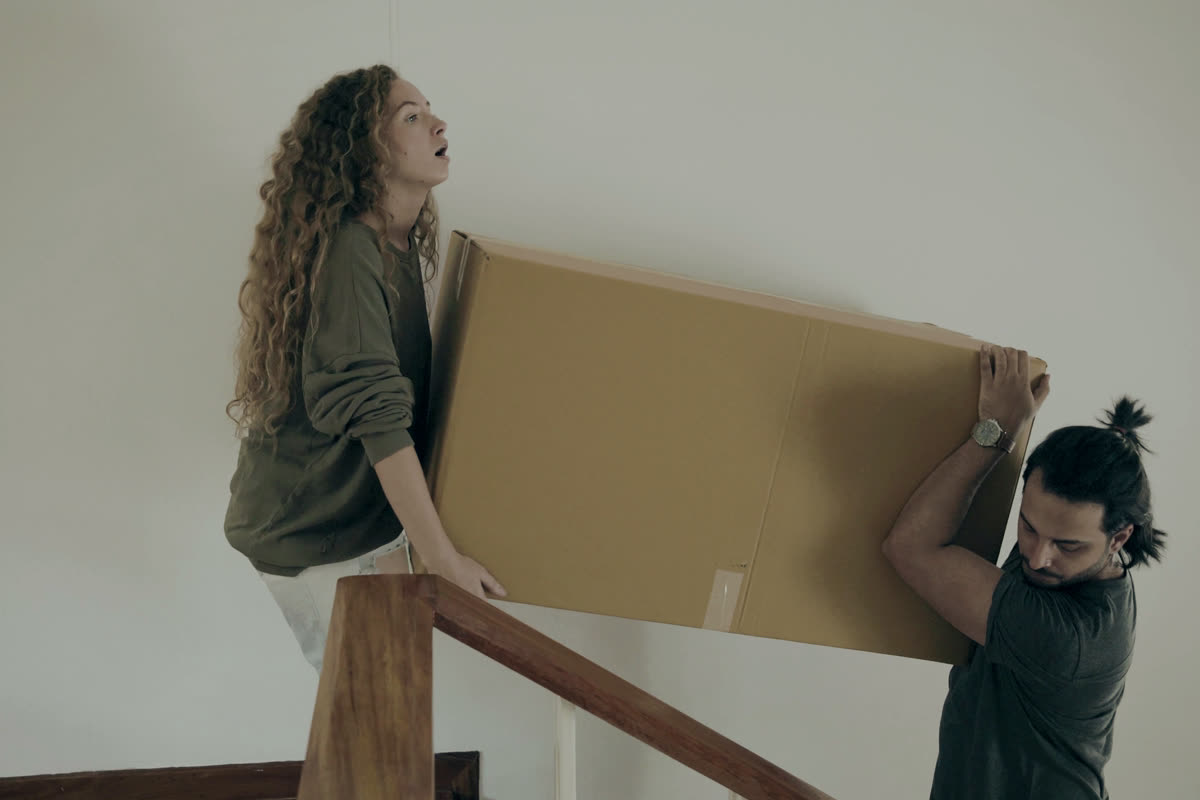 Carrying boxes into a new home